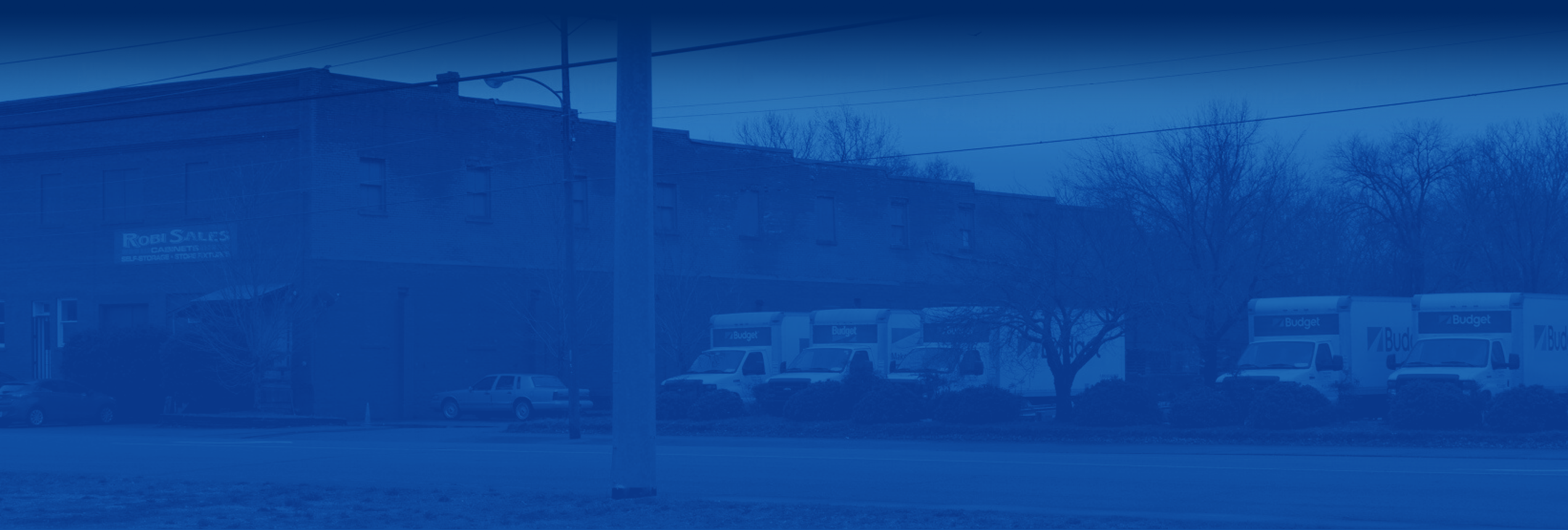 slider Budget trucks outside store facility